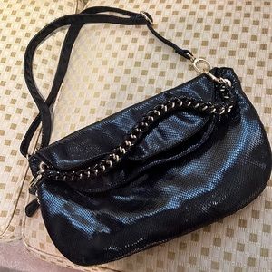 Almost brand new gorgeous faux snakeskin Deux Lux black purse.Detailed band